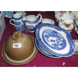 A modern pottery cheese dish and a quantity of blue and white Willow pattern china