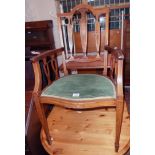 An Edwardian ornate inlaid mahogany framed elbow chair - sold with a matching standard chair -