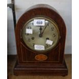 An Edwardian inlaid oak cased dome-top mantel clock with American gong striking movement