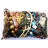 A bag containing a collection of mainly costume jewellery necklaces, etc.