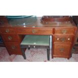 A 4' 8" modern Oriental hardwood twin pedestal desk with bracketed top, three frieze drawers and