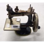 An early 20th Century Singer Model 20 toy sewing machine