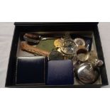 A box containing collectable items and medallions
