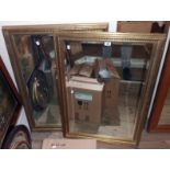 A modern ornate gilt framed bevelled oblong wall mirror - 3' 4" X 28" - sold with a matching