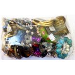 A bag containing a collection of mainly costume jewellery bracelets, etc.