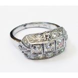 A marked PLAT 1930's style curved panel ring, set with three central diamonds within a diamond
