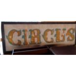 A painted wood Circus sign