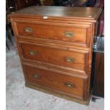 A 3' 2" Victorian pitch pine chest of three long graduated drawers with flush brass drop handles,