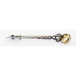 A Scottish white metal kilt pin set with a large citrine