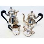 A Christople silver plated four piece coffee set with ornate cast and wooden handles and beaded