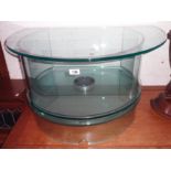 A 32" designer glass revolving TV stand