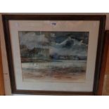 A framed watercolour, depicting a view with Carew Castle under stormy skies - indistinctly signed