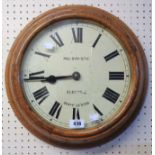 A 16" diameter vintage oak cased Pul-Syn-Etic electric dial wall timepiece, by Gents' of Leicester -