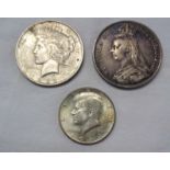 An 1889 Crown, a 1922 US Morgan Dollar, and a 1964 US Kennedy Half Dollar