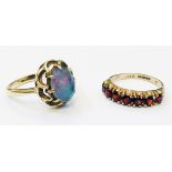 Two hallmarked 375 gold rings, one set with seven garnets, the other with doublet opal cabochon