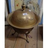 A brass coal bucket with lid