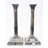 A pair of 12" silver plated column candlestick/table lamps with detachable nozzles and loaded