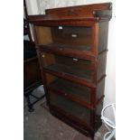 A 36" early 20th Century Globe Wernicke quarter sawn stained oak four section bookcase with