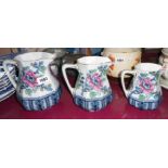 A set of three graduated Losol Ware jugs