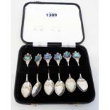 A cased set of six New Zealand marked Stg.Sil. coffee spoons, with paua shell inset terminals