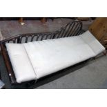 A 7' 20th Century cane framed chaise longue with swab cushion and decorative back - some cane