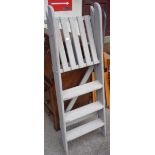 A painted wood step ladder