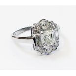 A marked PLAT Art Deco style panel ring, set with central princess cut 1.02ct. diamond, within a