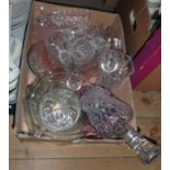 A box containing glassware including decanter, vases, bowl, etc.