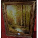 Jack Strickland: an ornate gilt framed oil on board, depicting an autumnal woodland with pool in
