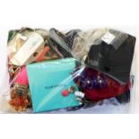 A bag containing assorted boxed and loose costume jewellery