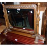 A 20th Century carved and polished oak framed dressing table mirror with flanking turned supports