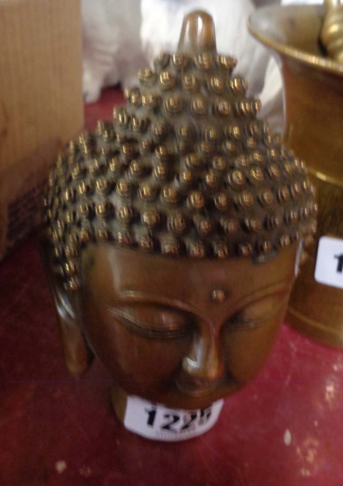 A reproduction brass Eastern head
