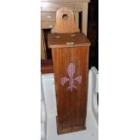 A French stained pine baguette bin with pierced decoration and crumb drawer under