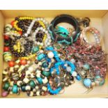 A box containing a quantity of costume jewellery necklaces and bracelets