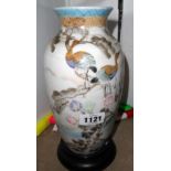 An Oriental vase with painted birds in a tree
