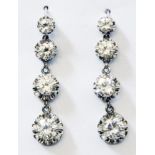 A pair of high carat white gold drop ear-rings, each set with four graduated diamonds
