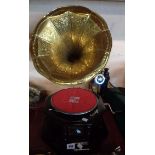 A modern reproduction gramophone with pressed brass horn