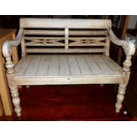 A 29" decorative painted wood and antiqued child's bench with pierced and moulded back, open