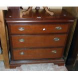 A 32" Stag mahogany effect three drawer chest in the antique style, set on bracket feet