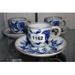 Three similar blue and white continental tea cups and saucers