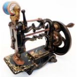 A Victorian James G. Weir cast iron chainstitch sewing machine with gilt and floral decoration