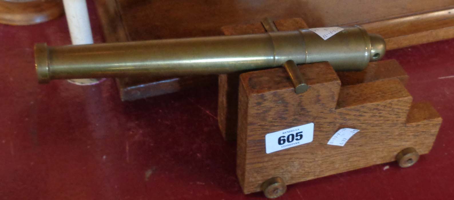 A brass and wood model cannon