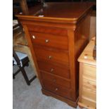 A 22 1/2" modern yew effect chest of five long drawers, set on bracket base