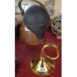 A reproduction brass car horn