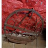 An antique rustic Irish wrought iron harnan stand or oatcake warmer