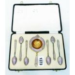 A cased set of marked 925 lilac enamelled and gilt coffee spoons and strainer marked for B.R. Lohne