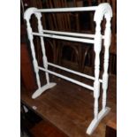 A painted blonde wood Victorian style double towel rail