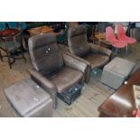 A pair of De Sede heavy brown leather upholstered reclining armchairs, set on standard ends with