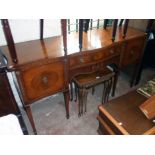 A 6' reproduction mahogany cross banded serpentine front sideboard in the Georgian style with two