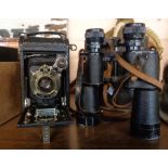An early 20th Century Kodak Autographic No. 1 Jr. bellows camera and a pair of Lieberman & Gortz 20X